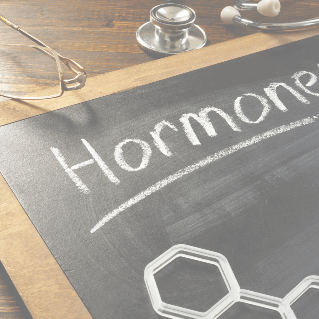 A chalk board with the word hormones written on it